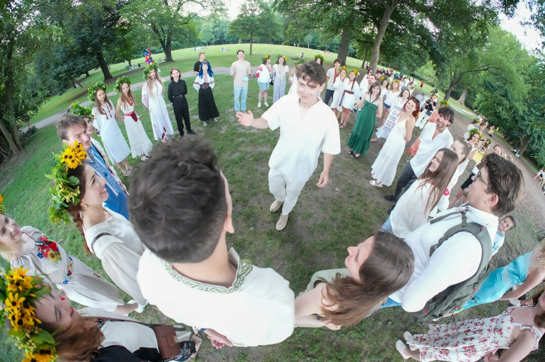 Small group of diverse adults sitting in a circle talking